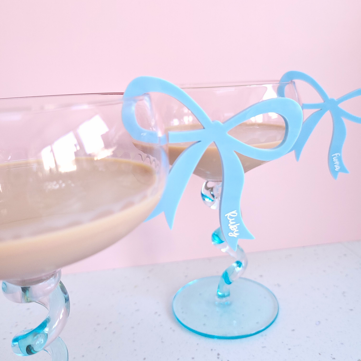 Blue acrylic bow drink charms.