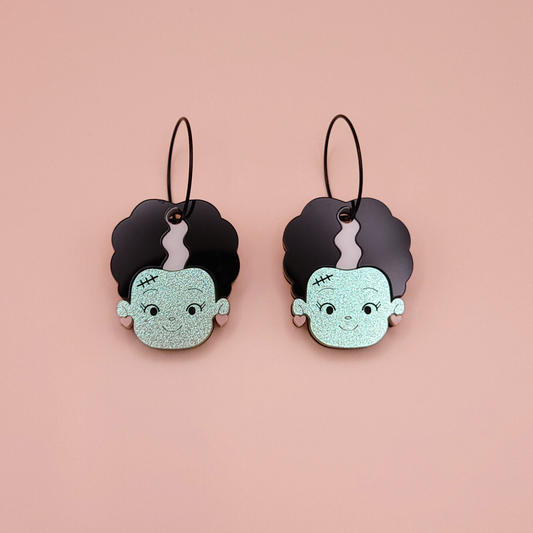 Silhouette earrings of the Bride of Frankenstein in acrylic  / wood with sculpted detail and hypoallergenic posts — gothic horror statement by Pop Heart Studio.
