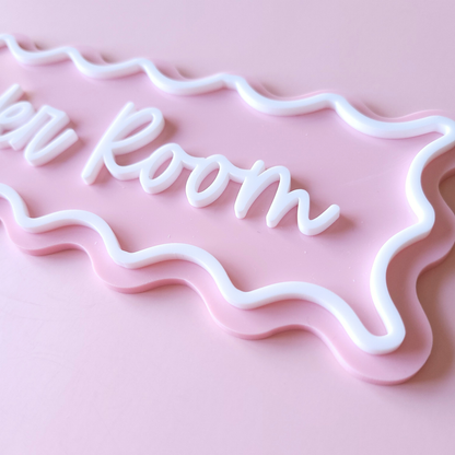 Modern acrylic bathroom door sign in pink pastel with wavy frame