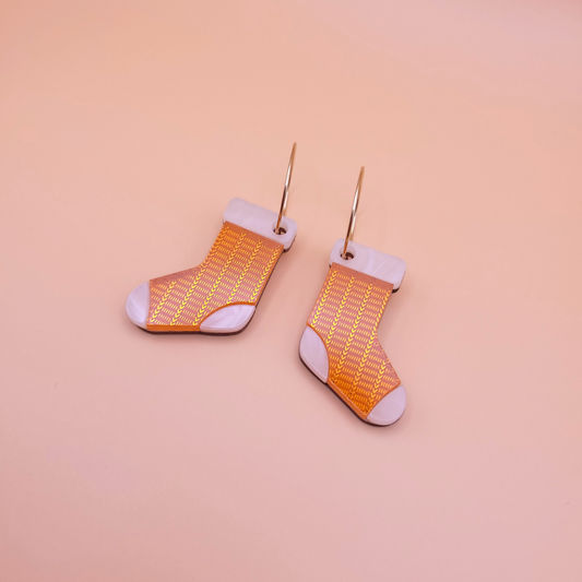 Orange knitted-look sock dangle earrings with stainless steel fittings — cosy autumn statement jewellery by Pop Heart Studio.