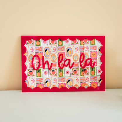 Handmade mixed media wall art with red acrylic lettering and patterned decoupage