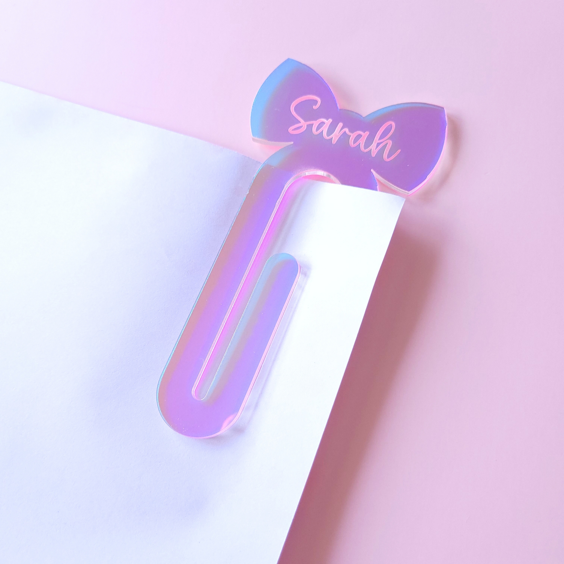 Iridescent girly acrylic bow bookmark with custom name Sarah.