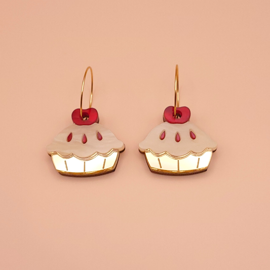 Layered acrylic apple pie slice dangle earrings with stainless steel fittings — cosy dessert statement jewellery by Pop Heart Studio.