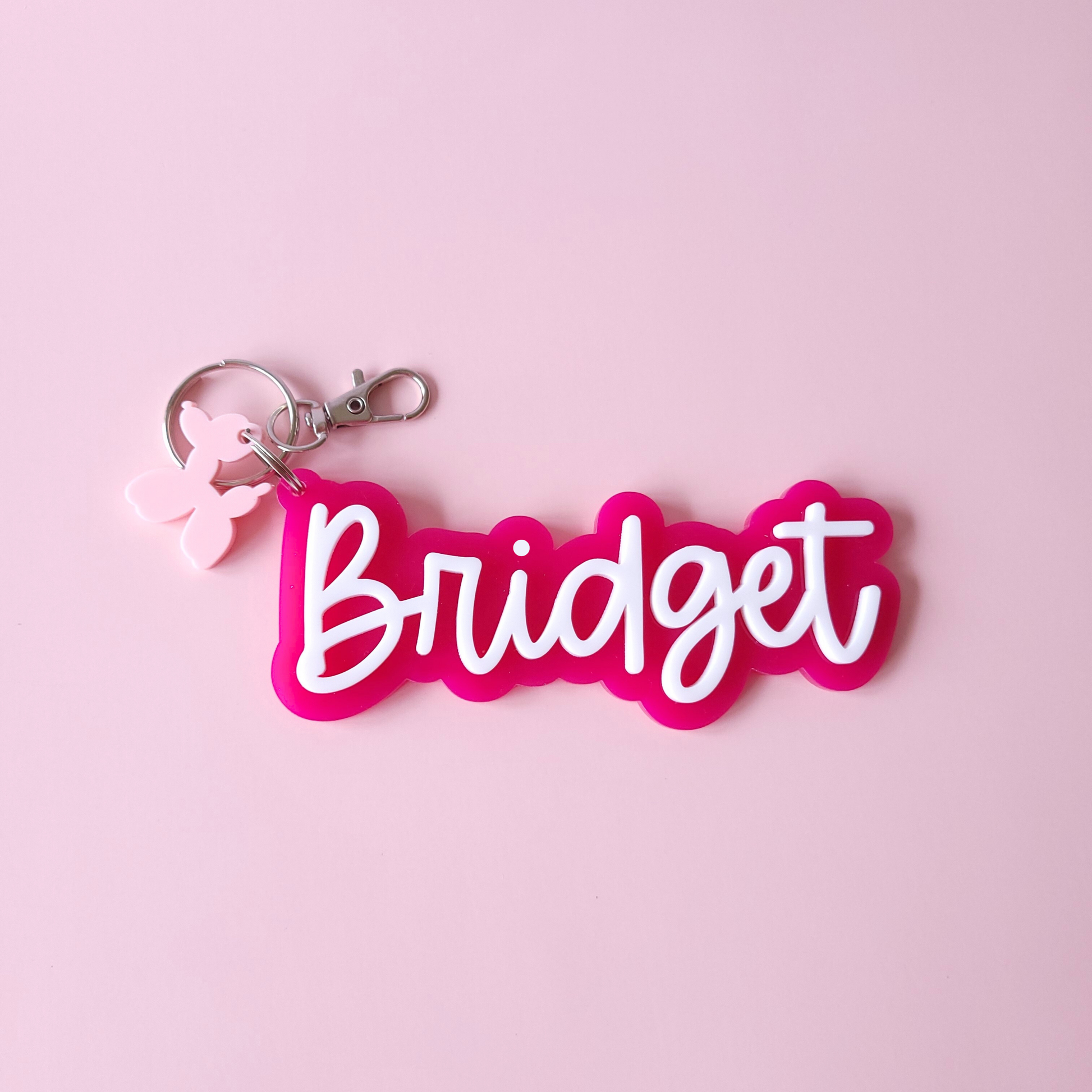 Personalised funky hot pink keyring with a charm
