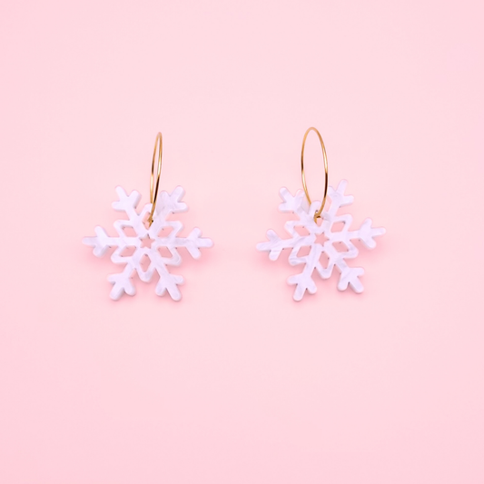 White marble acrylic snowflake earrings on gold hoops — handmade winter dangle earrings.